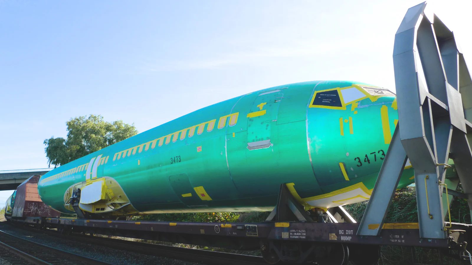Green Boeing 737 fuselages on railway flatcars bound for Renton in 2010.