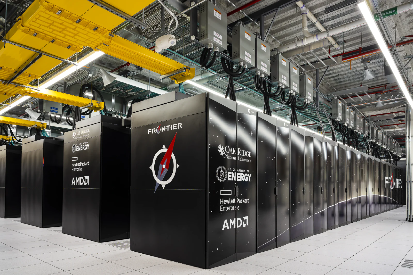 Frontier supercomputer cabinets and cooling infrastructure at Oak Ridge National Laboratory.